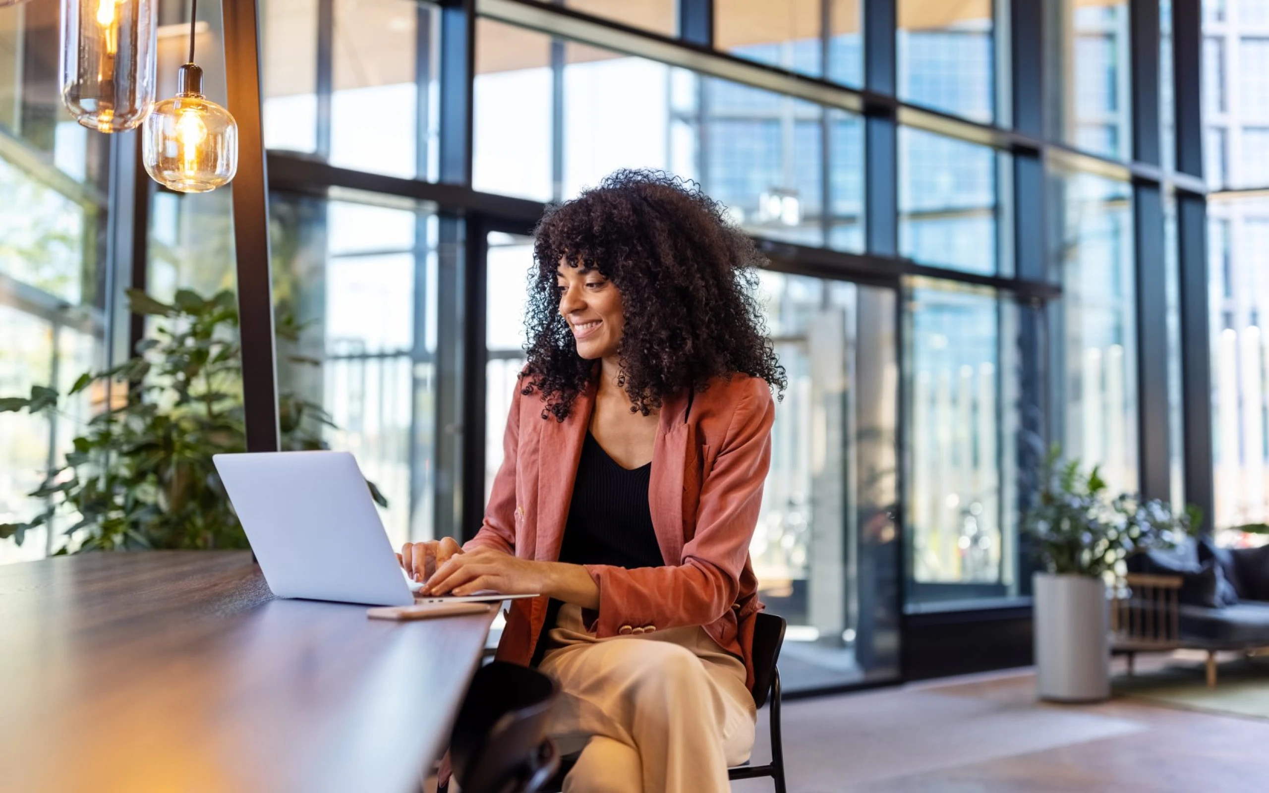 smiling woman on a laptop
